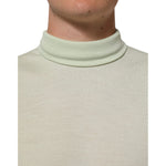 Dolce & Gabbana Light Green Logo TurtleNeck Pullover Sweater in soft virgin wool, close-up of turtleneck and light green fabric.