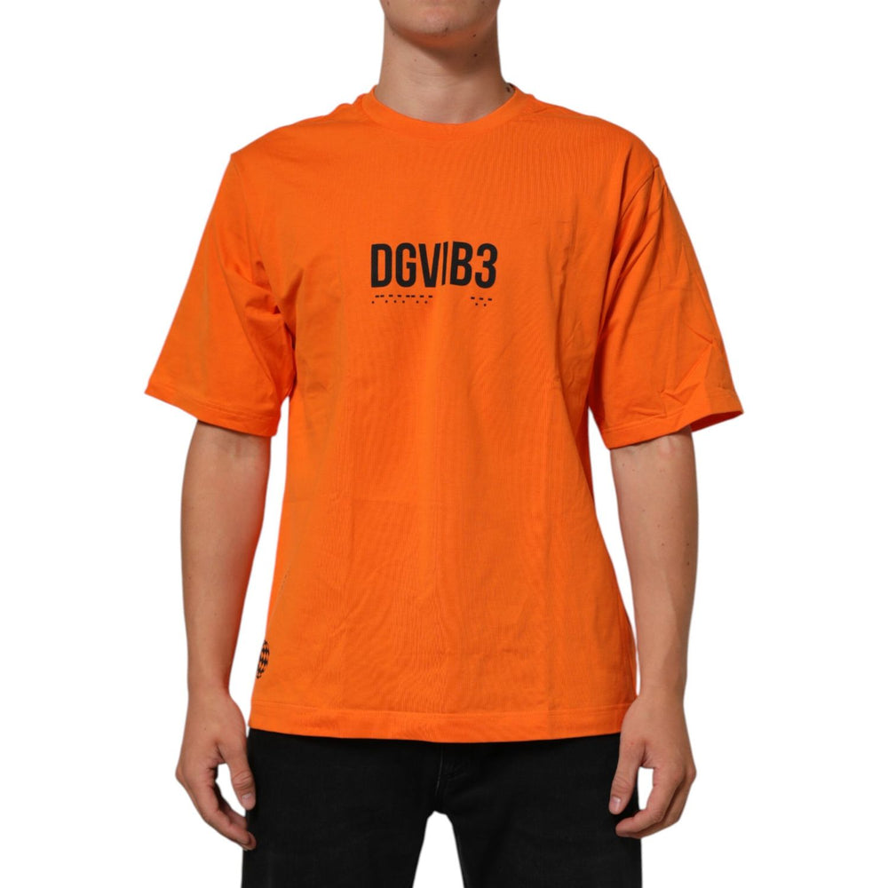 Dolce & Gabbana Orange DGVIB3 Crew Neck Short Sleeves T-shirt featuring bold design on model, made from 100% cotton for a modern look.