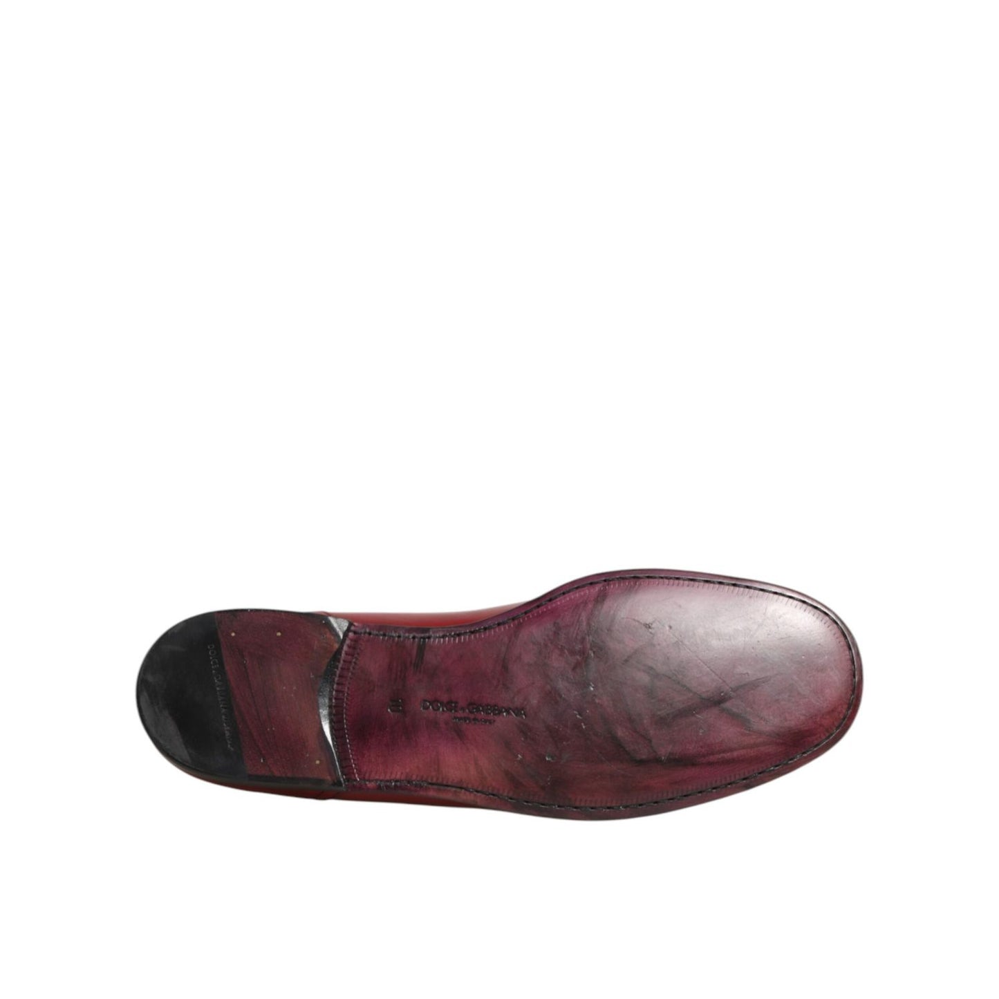 Sole view of Dolce & Gabbana Red Leather Slip On Dress Men Loafers Shoes, showing the craftsmanship of red leather.