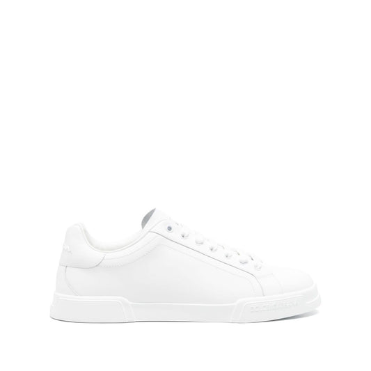 Dolce & Gabbana Sneakers White featuring lace-up fastening, round toe, and logo patch on a flat rubber sole.