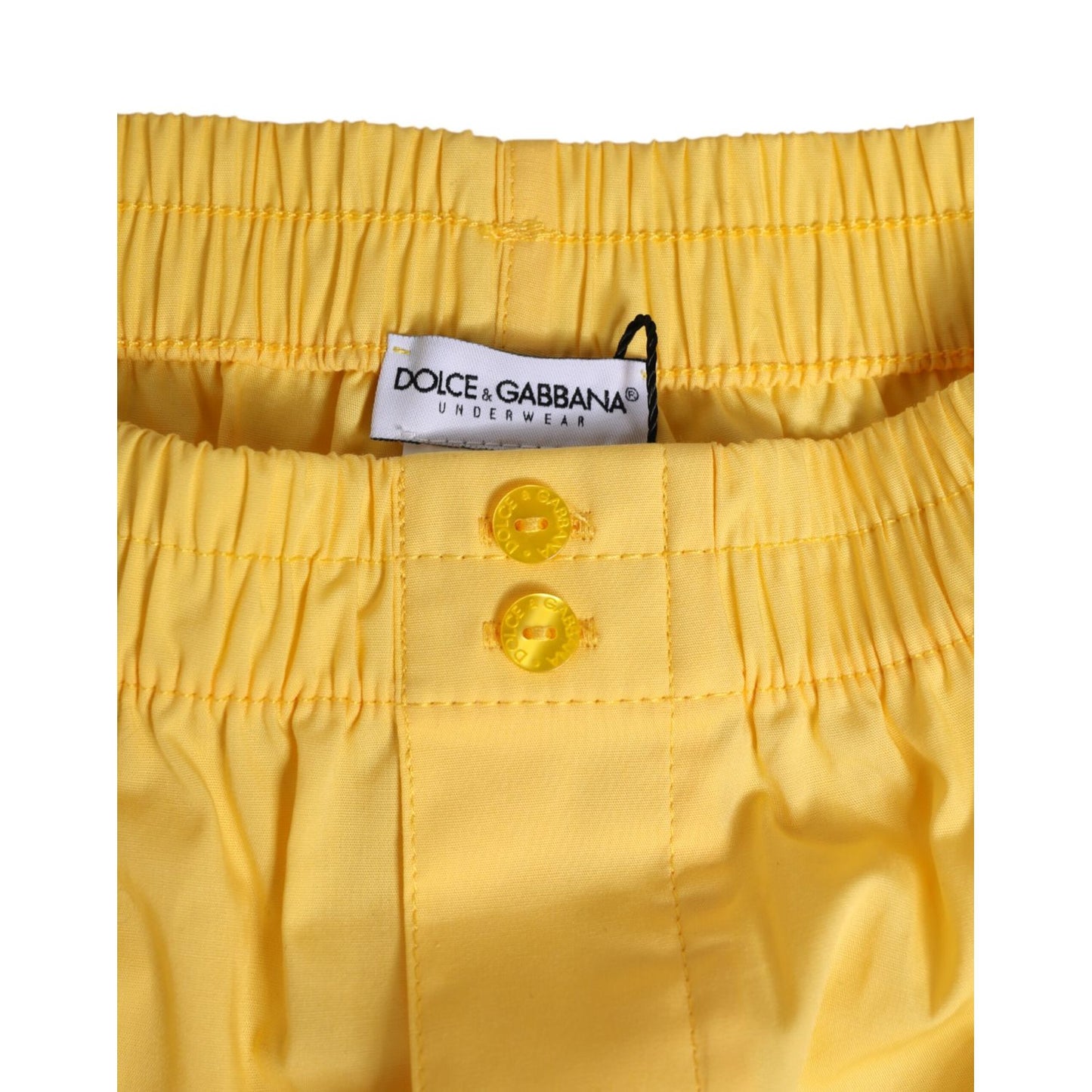 Dolce & Gabbana Yellow Cotton Elastic Waistband Short Swimwear with button detail and logo tag.