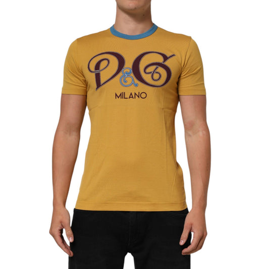 Dolce & Gabbana Yellow Logo Crew Neck Short Sleeves T-shirt on model showcasing front logo design and casual fit.