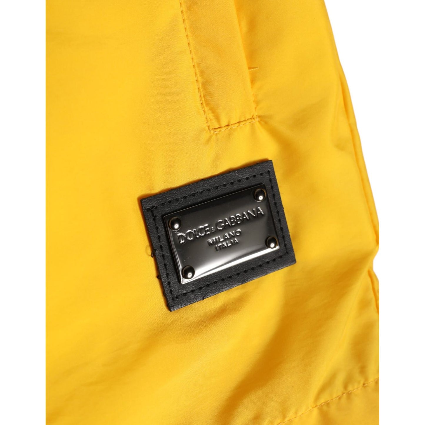 Dolce & Gabbana Yellow Nylon Logo Plaque Boxer Shorts Swimwear with iconic logo plaque detail on yellow fabric.