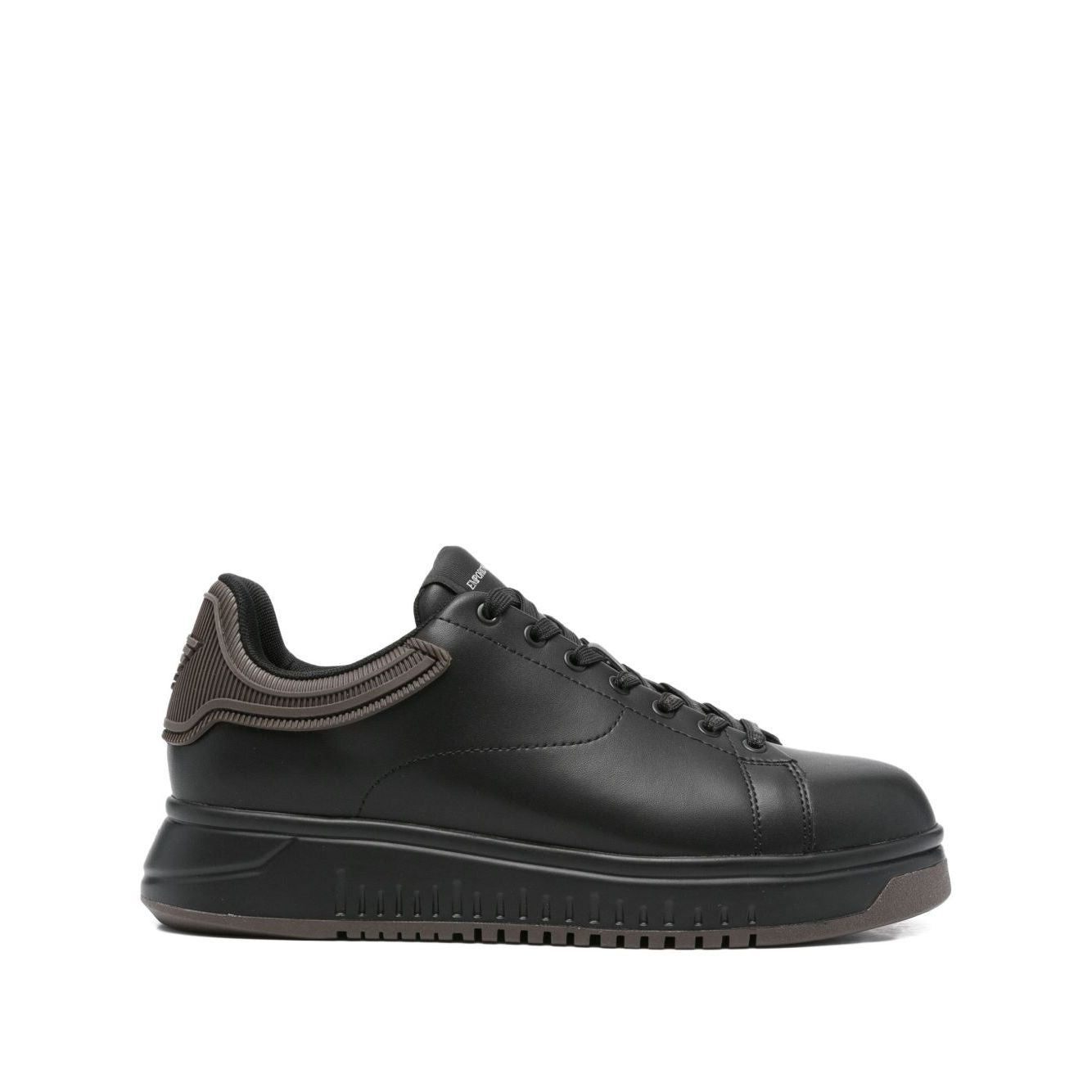 EMPORIO ARMANI EXCLUSIVE Lace-up low-top sneakers, black leather with ribbed panel and flat rubber sole, featuring tonal stitching.