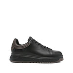 EMPORIO ARMANI EXCLUSIVE Lace-up low-top sneakers, black leather with ribbed panel and flat rubber sole, featuring tonal stitching.