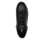 Top view of black leather EMPORIO ARMANI EXCLUSIVE Lace-up low-top sneakers with ribbed panels and flat rubber sole.