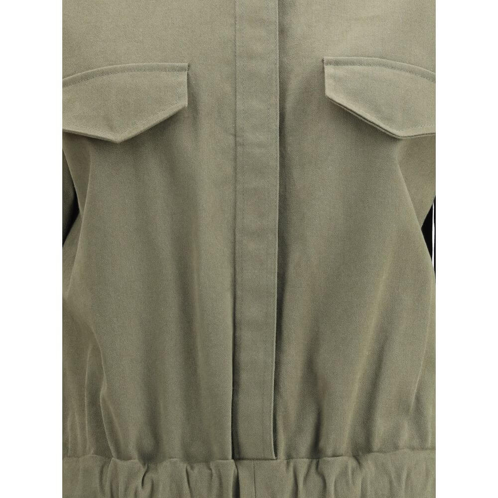 Close-up of Ella Green Cotton Jumpsuit featuring concealed button front and functional front welt pockets with flaps.