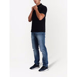 Emporio Armani T-shirts and Polos Blue navy cotton-blend polo with embroidered logo, short sleeves, worn by a man.