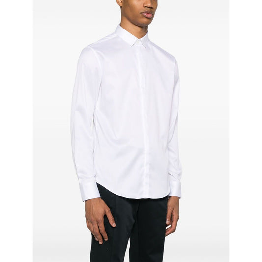 Emporio Armani shirt in white with long sleeves, classic collar, and buttoned cuffs, shown on a model, made of cotton, true to size fit.