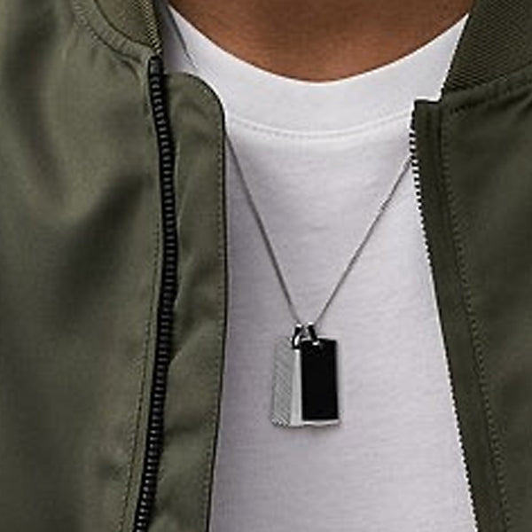 Stylish pendant necklace featuring the FOSSIL JEWELS JEWELRY Mod. JF04565040 worn by a person in a casual jacket.