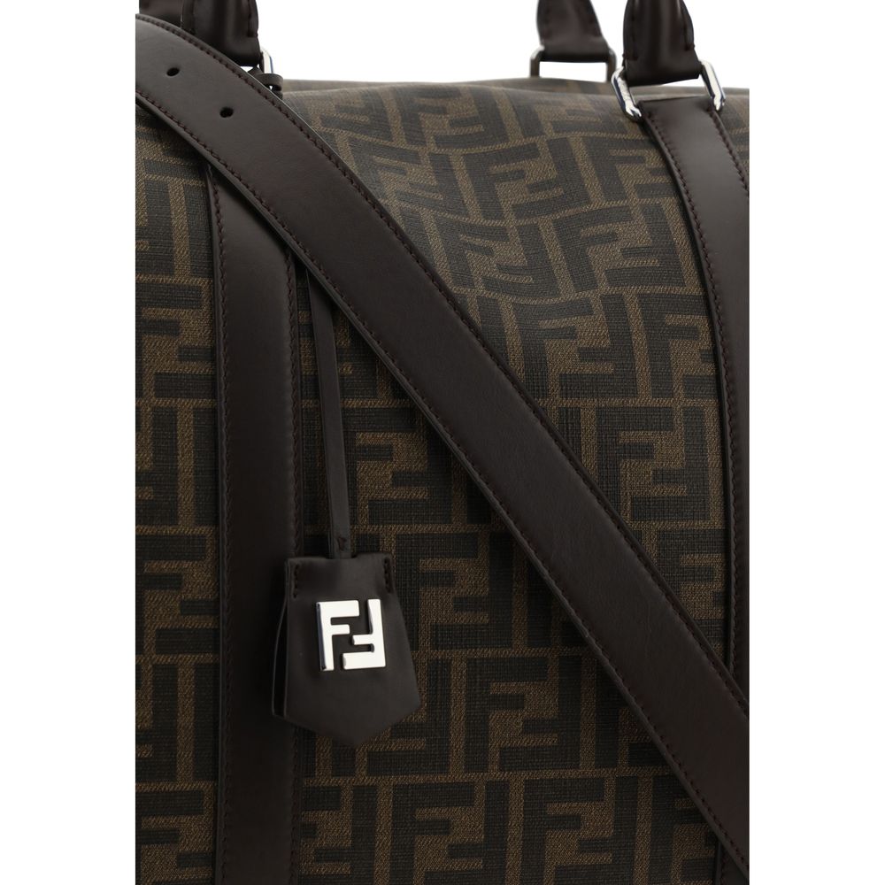 Close-up of Fendi Brown Canvas Luggage And Travel bag with FF monogram design and leather strap.