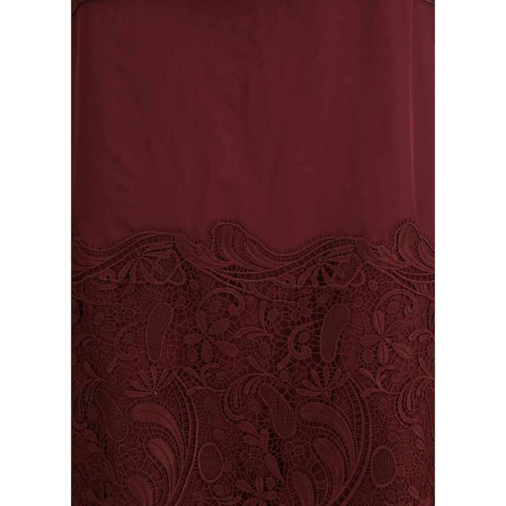 Detail of Ferragamo Bordeaux Silk Cocktail Dress with embroidery and silk chiffon.