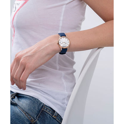 Lady wearing GUESS Mod. GW0356L1 silver earrings with mineral dial quartz analog, 3 ATM water resistant.