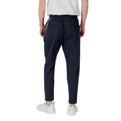 Back view of Gianni Lupo Blue Cotton Casual Pants with elastic waistband and ankle-length design, perfect for modern, urban style.