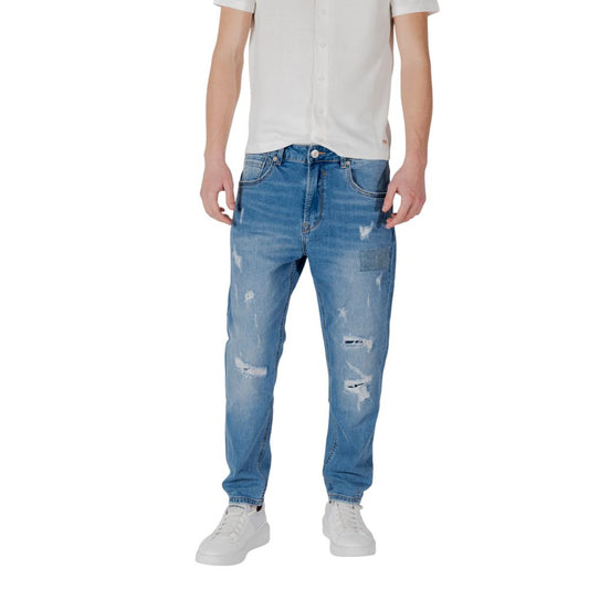 Gianni Lupo Blue Cotton Relaxed Fit Jeans with abrasions and rips, shown on a model wearing a white shirt and sneakers.