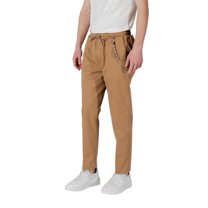 Model wearing Gianni Lupo Brown Cotton Casual Pants with elastic waistband and drawstring.