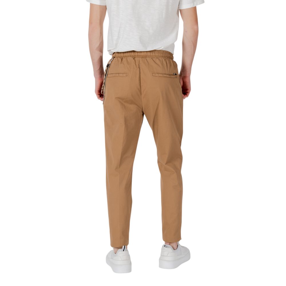 Back view of Gianni Lupo Brown Cotton Casual Pants with elastic waistband and ankle-length cut.