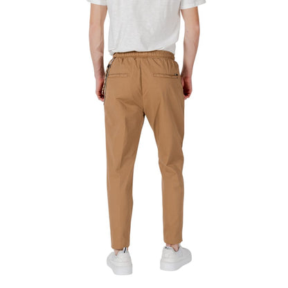 Back view of Gianni Lupo Brown Cotton Casual Pants with elastic waistband and ankle-length cut.