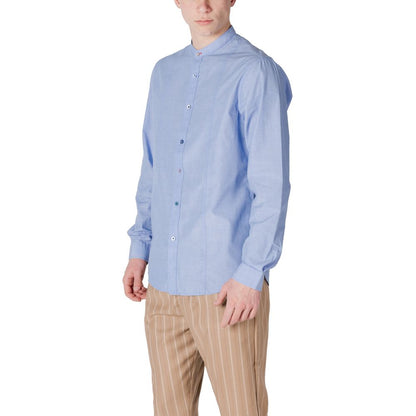 Gianni Lupo Light Blue Cotton Shirt for men with long sleeves, elegant and versatile for various occasions, paired with striped trousers.