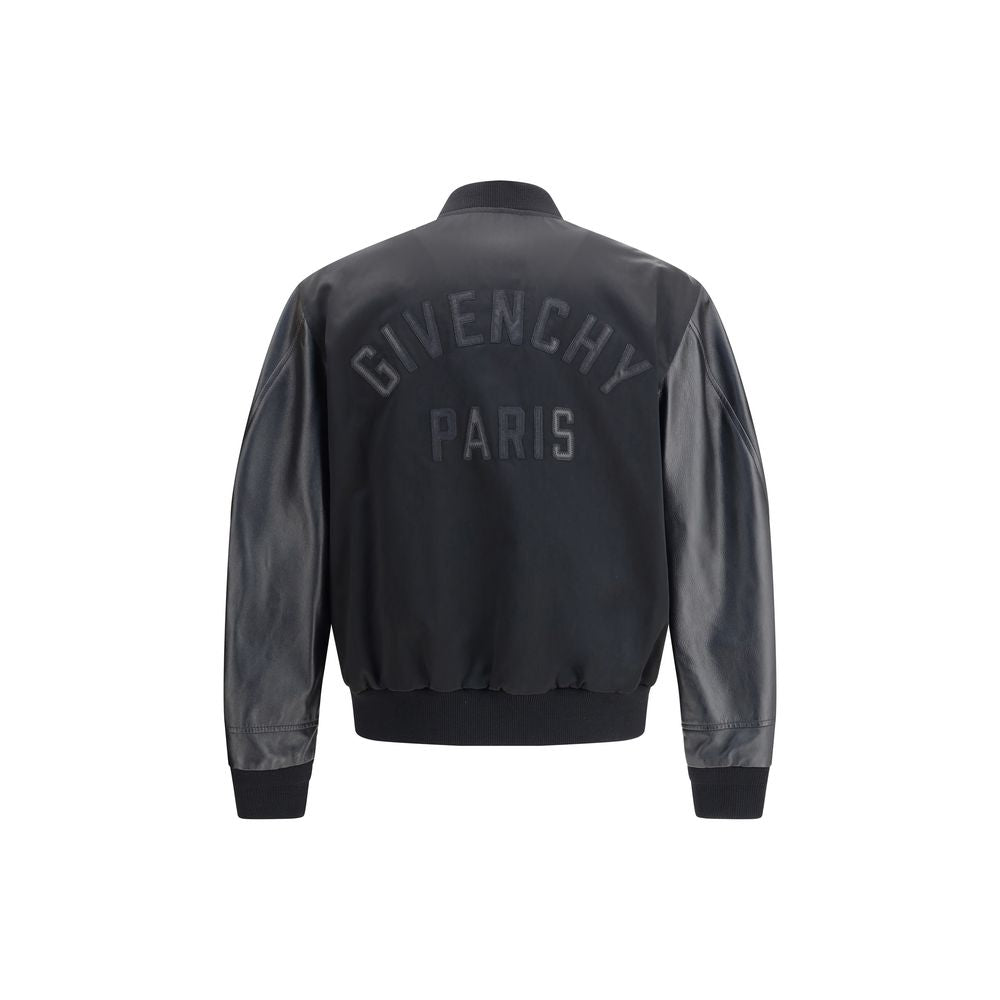 Givenchy Black Cotton Bomber with satin body, leather sleeves, and GIVENCHY Paris logo applique on the back.