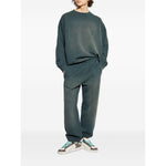 Golden Goose Trousers Black with blue elasticated waistband, side welt pockets, and embroidered logo, shown worn by model with sneakers.