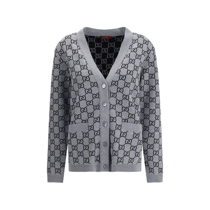 Gucci Black Wool Cardigan with GG Supreme reversible pattern, V-neckline, front pockets, and ribbed trim in black and white.