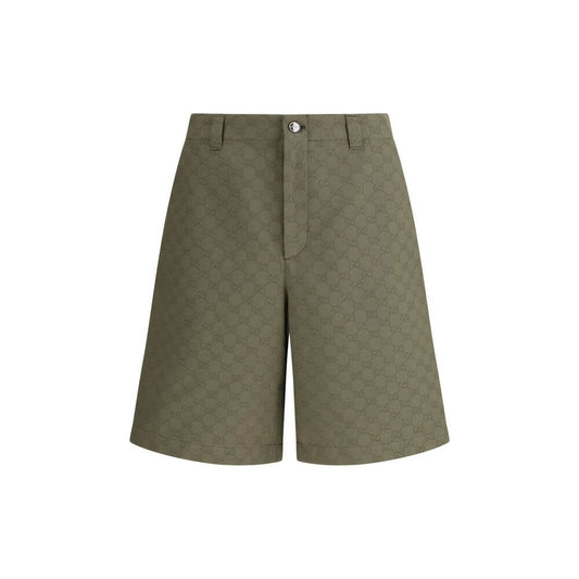 Gucci Green Cotton Bermuda Shorts with GG pattern, front zipper, button closure, and belt loops, perfect for a distinctive casual look.