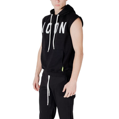 Model wearing Icon Black Cotton Hoodie with large logo, sleeveless design, and front pocket for a trendy, functional look.