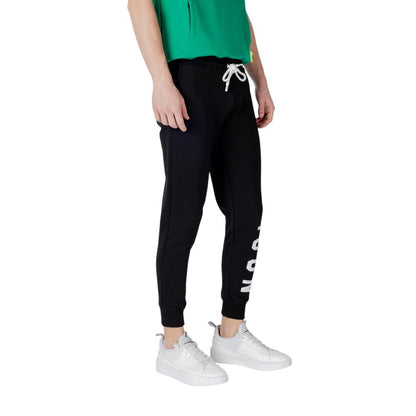 Model wearing Icon Black Cotton Joggers (Workout Pants) with white lettering and drawstring, perfect for comfort and style.