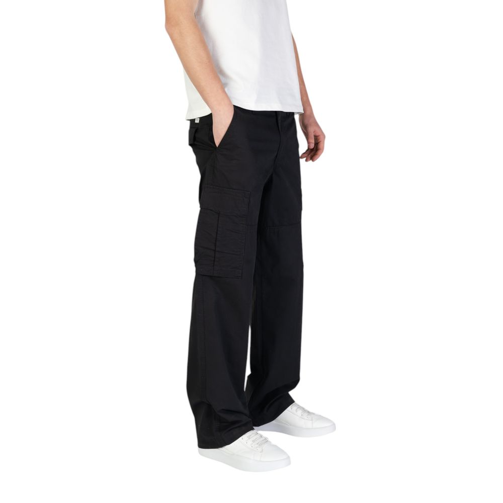 Model wearing Jack Jones Black Cotton Cargo Pants with side pockets and relaxed fit, showcasing casual style and comfort.