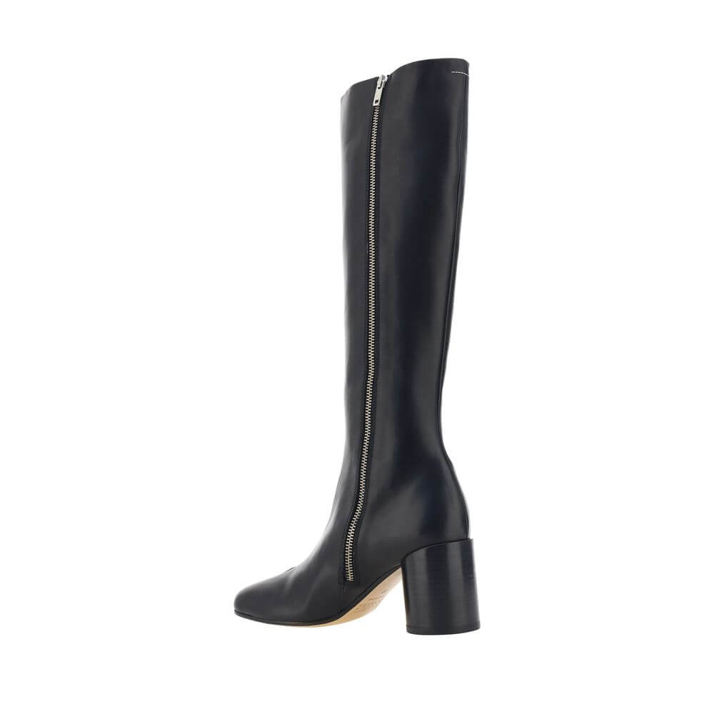 MM6 Black Calf Leather Bos Taurus Boots with iconic Tabi toe design, knee-high style, and cylindrical heel for AW25 season.