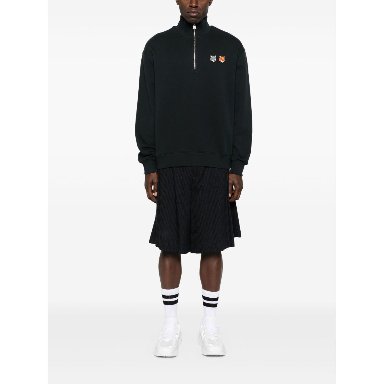 Model wearing Maison Kitsuné MAISON KITSUNE' Sweaters Grey featuring half zip, fox motif, and ribbed cuffs.