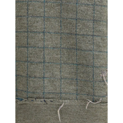 Close-up of Margiela Green Fleece Wool Sweatshirt grid pattern detail, showcasing soft wool texture for autumn-winter season style.