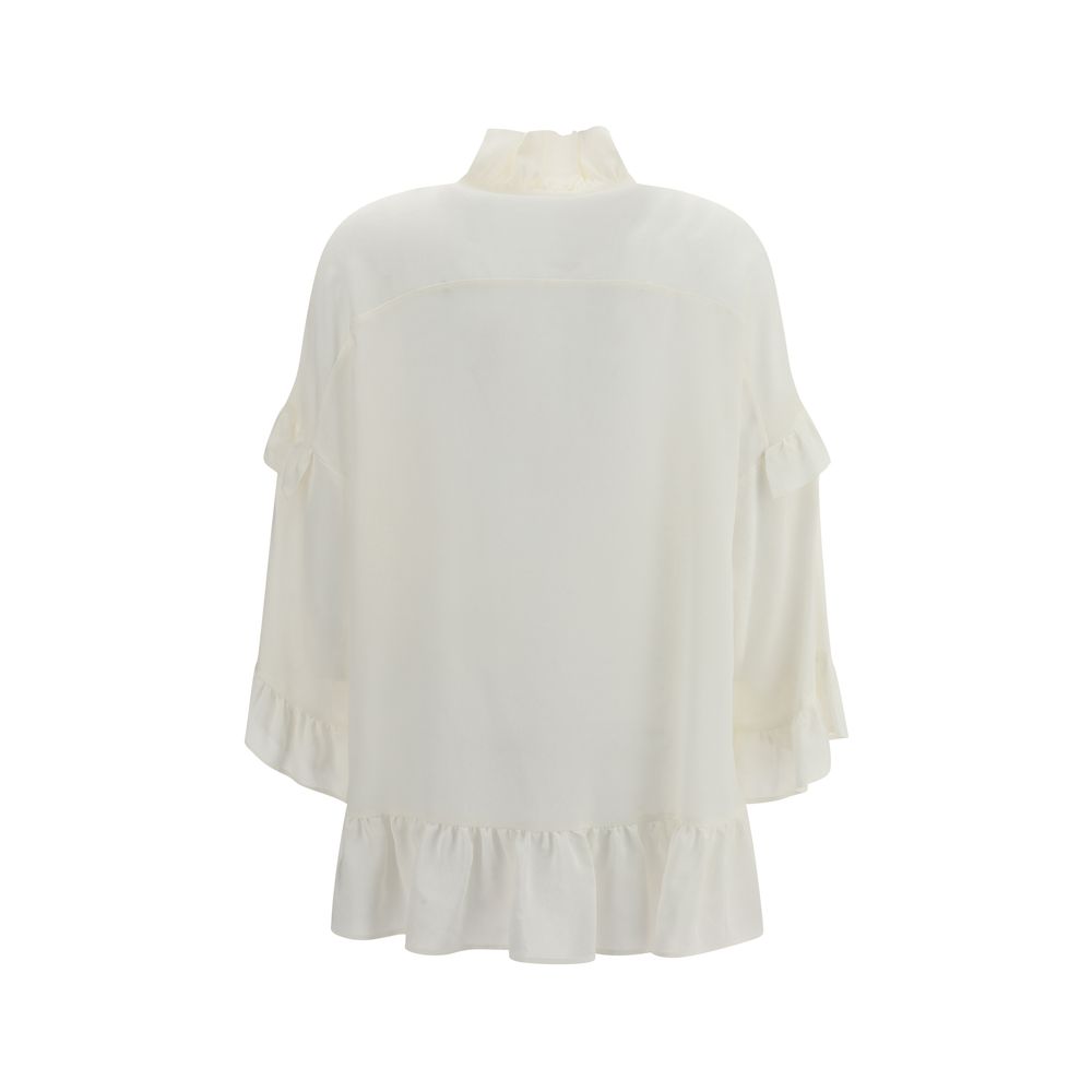 Back view of P.A.R.O.S.H. Cream Silk Blouse with ruffle details and bow closure, elegant design for AW25 season.