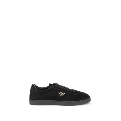 Prada Black Calf Leather Bos Taurus Low Top Sneakers with rubber sole and triangular plaque design, suede finish, and logo detailing.