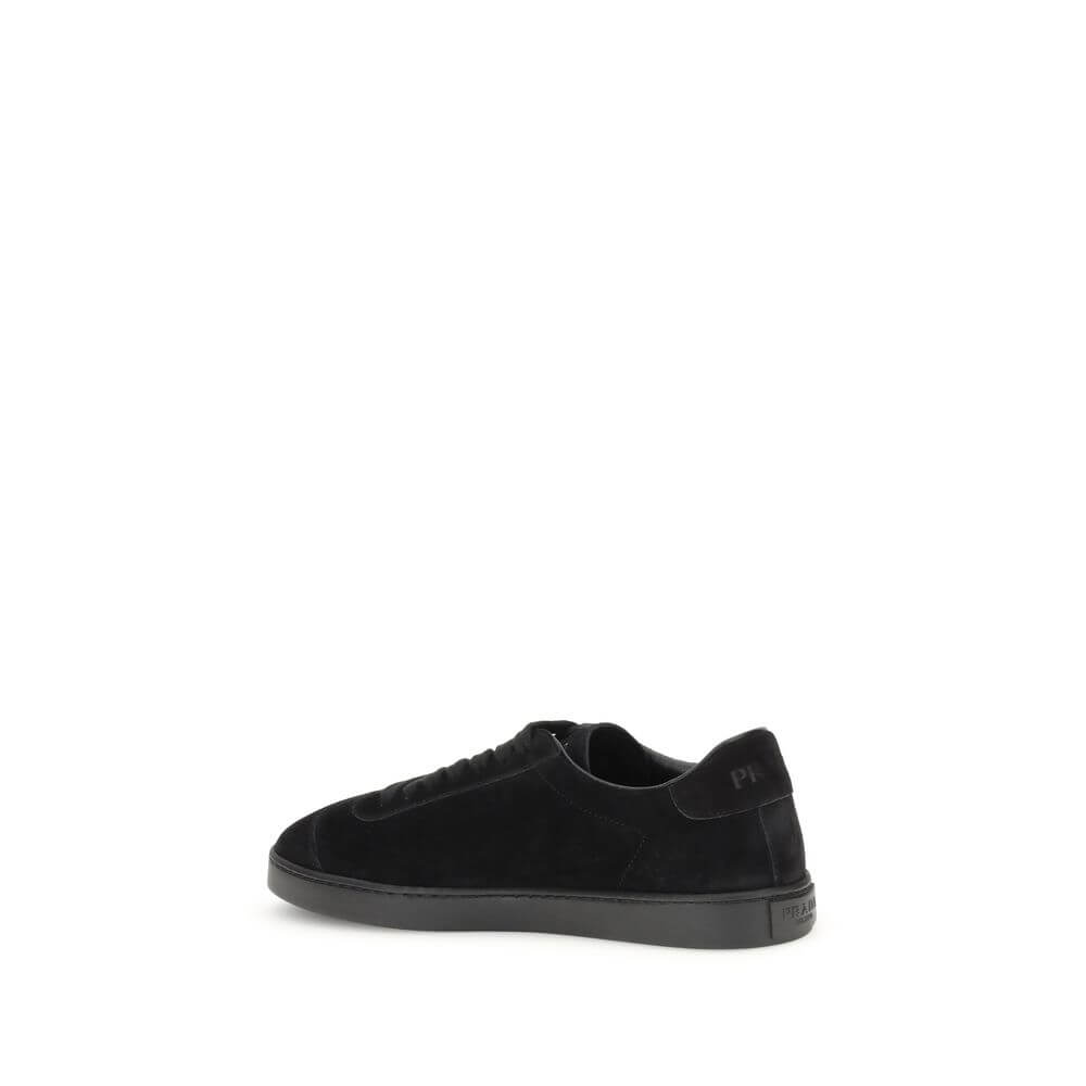 Prada Black Calf Leather Bos Taurus Low Top Sneakers with rubber sole and triangular side plaque.