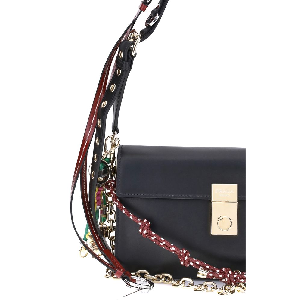 Prada Black Calf Leather Bos Taurus Shoulder Bag with metallic logo and decorative accessories on a versatile strap.