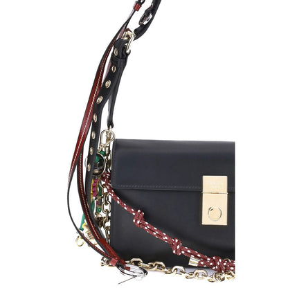 Prada Black Calf Leather Bos Taurus Shoulder Bag with metallic logo and decorative accessories on a versatile strap.