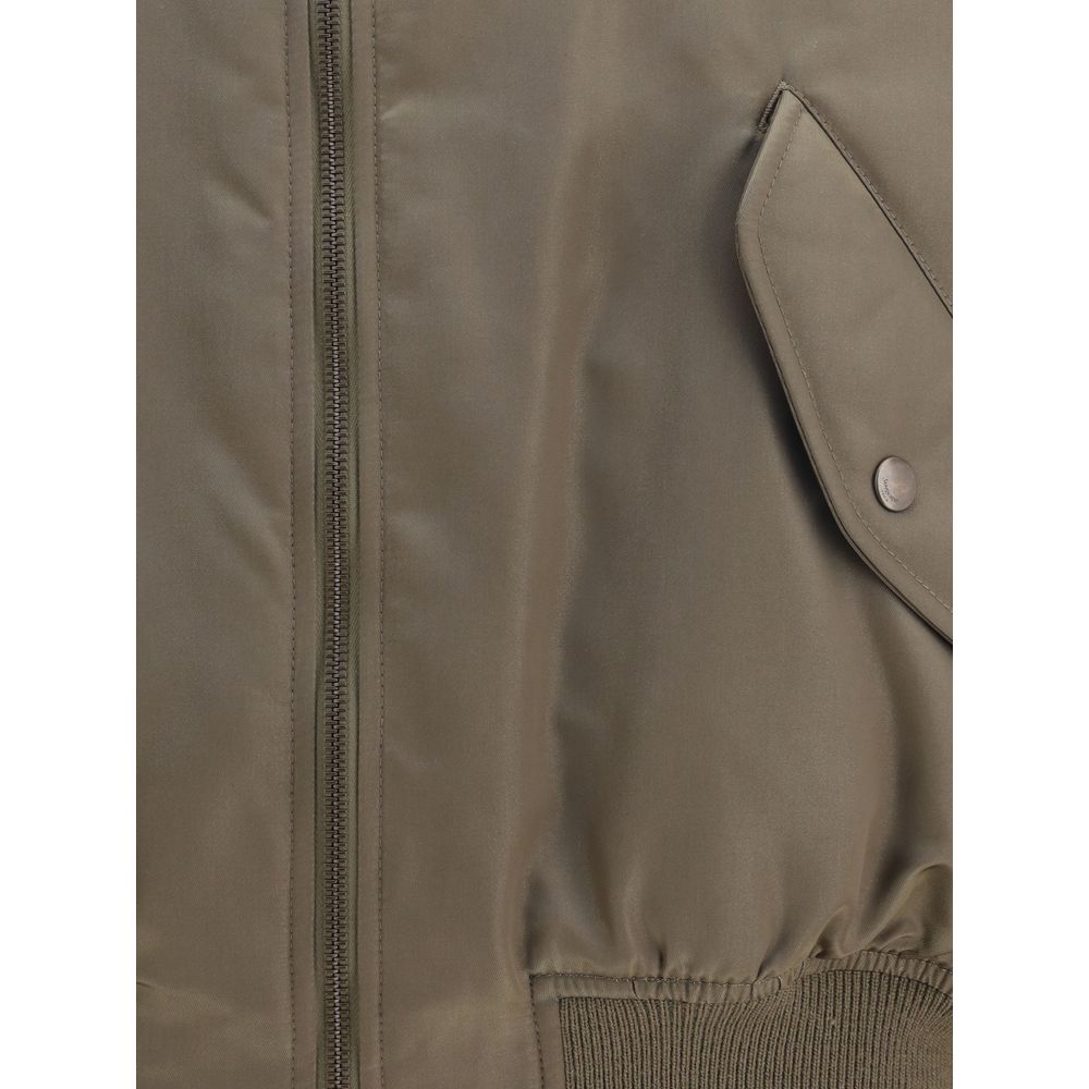 Close-up of Saint Laurent Bicolor Polyamide Bomber with water-repellent fabric and snap pocket detail.