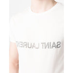 Man wearing a white Saint Laurent Logo T-shirt with reverse logo print, round neck, short sleeves, made of cotton.
