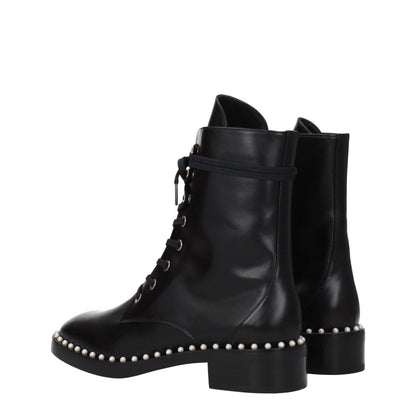 Stuart Weitzman Black Leather Ankle Boots with beaded design, punk rock style, lace-up closure, mid heels, rubber sole, round toe.
