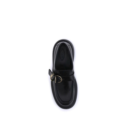 Top view of Tod's Black Rubber Platform Loafers with metal rings and nappa leather, showcasing elegant and contemporary design.