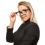 Woman wearing Tod's Black Women Glasses Frame, round full-rim style with black plastic frame and demo lenses.