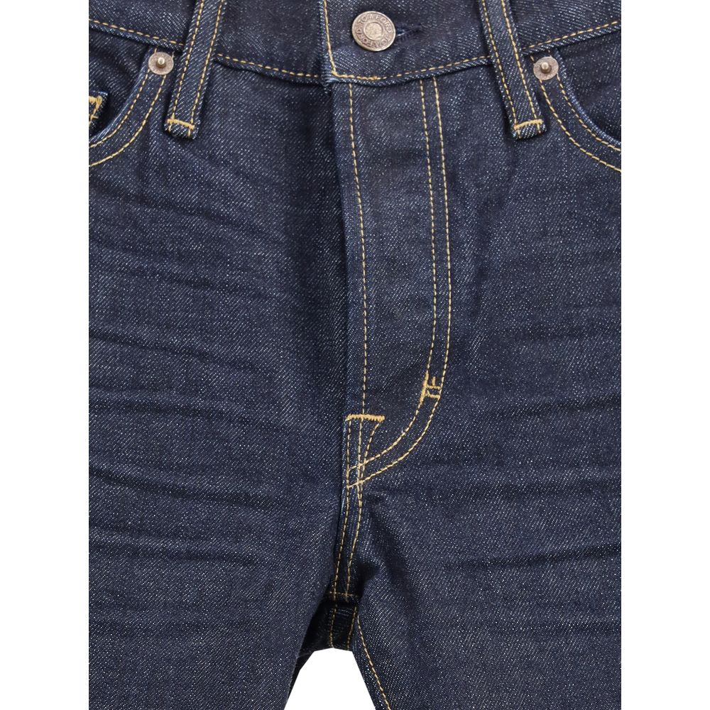 Close-up of Tom Ford Blue Cotton Straight-Leg Jeans showcasing button closure and classic 5-pocket design in selvedge denim.