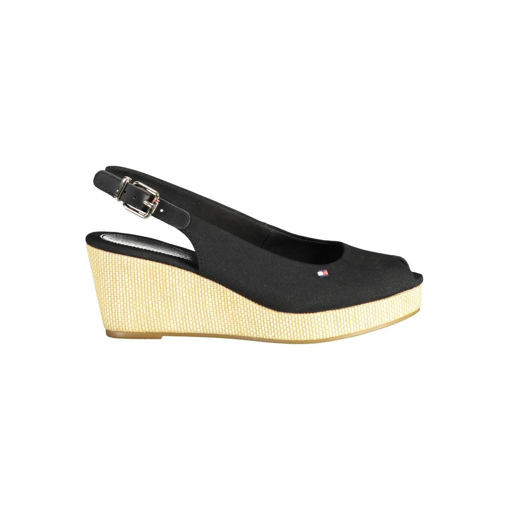 Tommy Hilfiger Black Leather Women Sandal with wedge heel and ankle buckle closure, featuring iconic logo, perfect for stylish events.