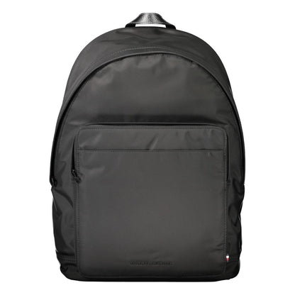 Tommy Hilfiger Black Polyester Backpack with adjustable straps and laptop compartment, featuring a zip closure and logo detail.