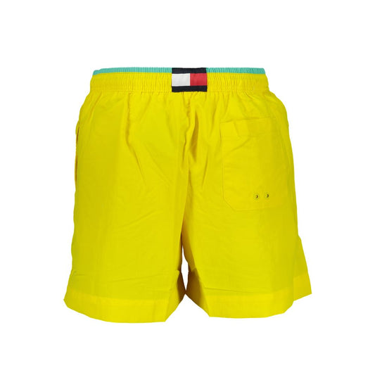 Tommy Hilfiger Yellow Nylon Swimwear, medium swim boxer with elastic waist, pockets, and contrasting details. 95% recycled nylon.