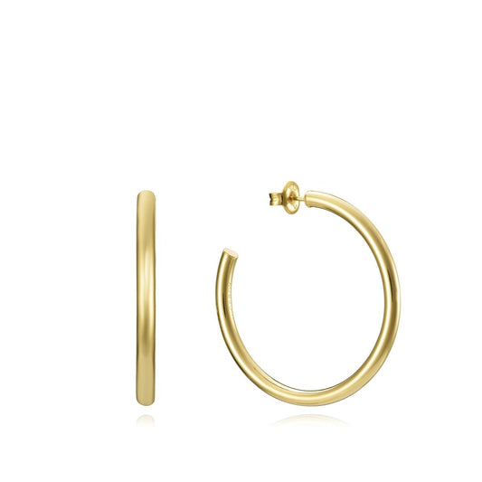 Gold hoop earrings on display, representing elegant style and sophistication.