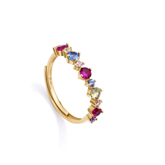 Colorful gemstone gold ring with sapphire, ruby, and emerald stones in a delicate setting on a white background.