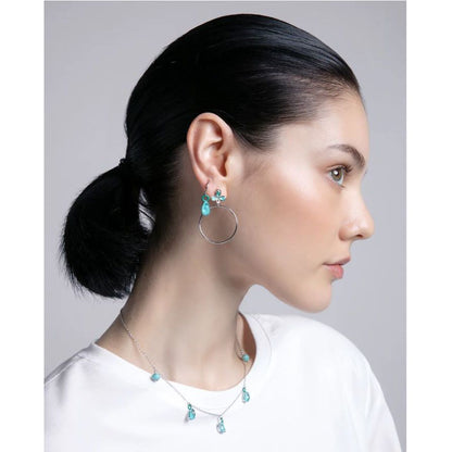 Woman wearing VICEROY JEWELS Mod. 13198E000-33 earrings showcasing elegant silver design and turquoise accents.